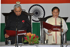 The Governor of Arunachal Pradesh Lt. Gen (Retd) Nirbhay Sharma administering the oath of office and secrecy  to Shri Nabum Tuki as the latter is being sworn-in as the Chief Minister at Darbar Hall, Raj Bhavan on 18th May 2014